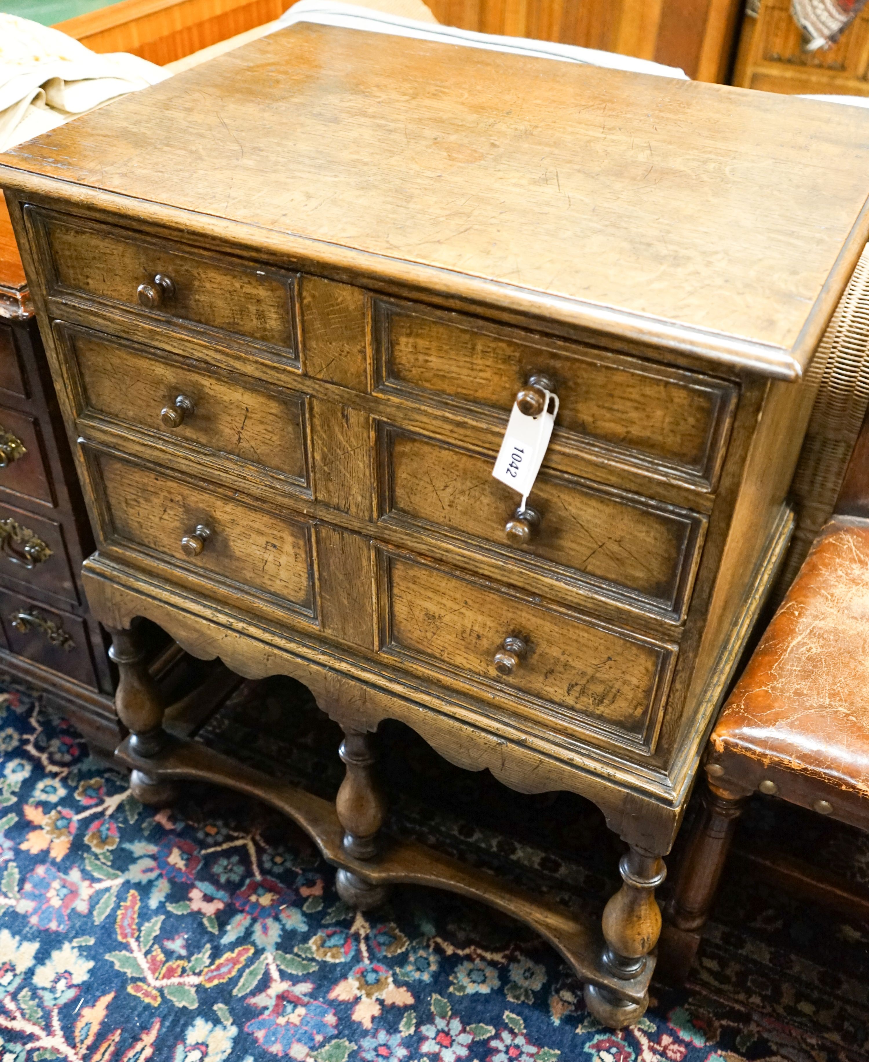 A 17th century style small oak chest on stand